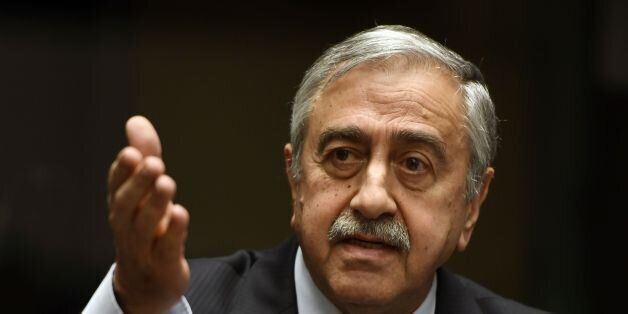 Turkish Cypriot leader Mustafa Akinci gestures as he speaks during a press conference on UN-sponsored Cyprus peace talks on January 13, 2017 at the Unites Nations headquarters in Geneva.Hopes for a peace deal in Cyprus stalled on January 13, 2017 over a decades-old dispute, with the rival sides at loggerheads over the future of Turkish troops on the divided island. A week of UN-brokered talks in Geneva between Greek Cypriot President and Turkish Cypriot leader sparked optimism that an agreement