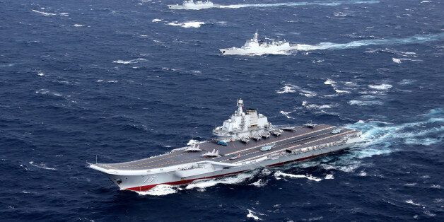 China's Liaoning aircraft carrier with accompanying fleet conducts a drill in an area of South China Sea, in this undated photo taken December, 2016. REUTERS/Stringer ATTENTION EDITORS - THIS IMAGE WAS PROVIDED BY A THIRD PARTY. EDITORIAL USE ONLY. CHINA OUT.