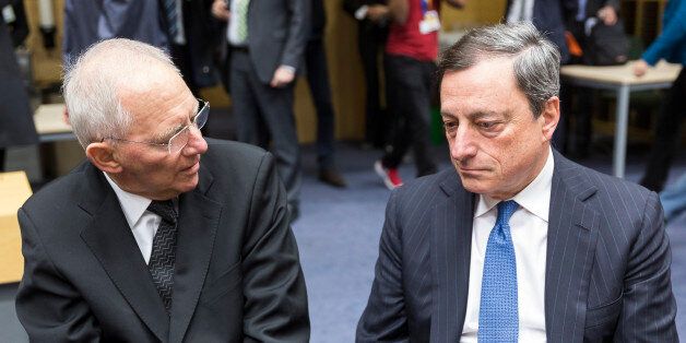 Brussels, Belgium, February 11, 2015. -- German Finance Minister Wolfgang SchÃ¤uble (Schaeuble) (L) is talking with President of the European Central Bank Mario Draghi (R) prior an emergency Eurogroup finance ministers meeting at the European Council. (Photo by Thierry Tronnel/Corbis via Getty Images)