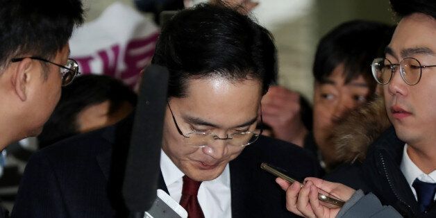 Jay Y. Lee, co-vice chairman of Samsung Electronics Co., bows as he arrives at the special prosecutors' office in Seoul, South Korea, on Thursday, Jan. 12, 2017. Special prosecutors began questioning Lee on Thursday as a suspect in a bribery investigation, deepening an influence-peddling scandal that has already led to the impeachment of South Korea's president. Photographer: SeongJoon Cho/Bloomberg via Getty Images