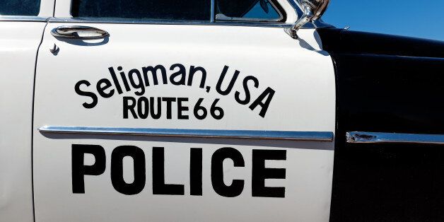 Route 66 sign on Police car in Seligman, Arizona, USA.