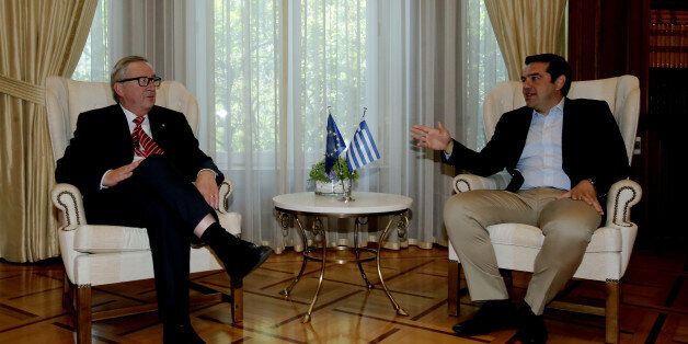 Greek prime Minister Alexis Tsipras (R) with Jean-Claude Juncker, President of the European Commission, during their meeting, at Maximos mansion, in Athens on June 21, 2016 (Photo by Panayiotis Tzamaros/NurPhoto via Getty Images)