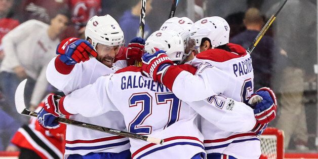NEWARK, NJ - FEBRUARY 27: Montreal Canadiens center Alex Galchenyuk (27) celebrates with teammates after scoring the game winning goal during the overtime period of the National Hockey League game between the New Jersey Devils and the Montreal Canadiens on February 27, 2017, at the Prudential Center in Newark, NJ. The Montreal Canadiens defeat the New Jersey Devils 4-3 in overtime. (Photo by Rich Graessle/Icon Sportswire via Getty Images)