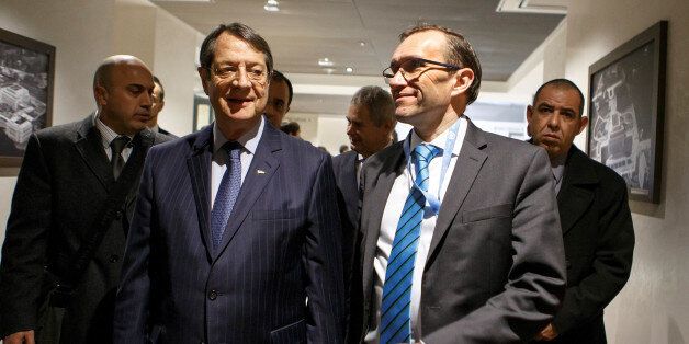 Greek Cypriot President Nicos Anastasiades (L) and Special Adviser to the United Nations Secretary-General on Cyprus Espen Barth Eide, arrive for a new round of Cyprus Peace Talks, at the European headquarters of the United Nations, in Geneva, Switzerland, January 9, 2017. REUTERS/Salvatore Di Nolfi/Pool