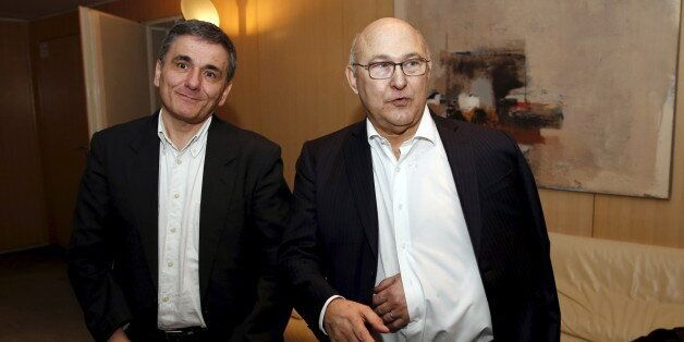 French Finance Minister Michel Sapin (R) meets Greek Finance Minister Euclid Tsakalotos at the ministry in Paris, January 10, 2016. REUTERS/Philippe Wojazer