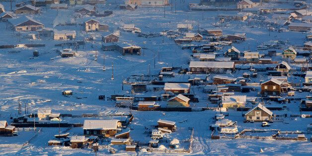 A general view of the village of Tomtor in the Oymyakon valley, in the Republic of Sakha, northeast Russia, January 28, 2013. The coldest temperatures in the northern hemisphere have been recorded in Sakha, the location of the Oymyakon valley, where according to the United Kingdom Met Office a temperature of -67.8 degrees Celsius (-90 degrees Fahrenheit) was registered in 1933 - the coldest on record in the northern hemisphere since the beginning of the 20th century. Yet despite the harsh climate, people live in the valley, and the area is equipped with schools, a post office, a bank, and even an airport runway (albeit open only in the summer). Picture taken January 28, 2013. REUTERS/Maxim Shemetov (RUSSIA - Tags: SOCIETY CITYSCAPE ENVIRONMENT)ATTENTION EDITORS: PICTURE 9 OF 27 FOR PACKAGE 'THE POLE OF COLD'SEARCH 'MAXIM COLD' FOR ALL IMAGES