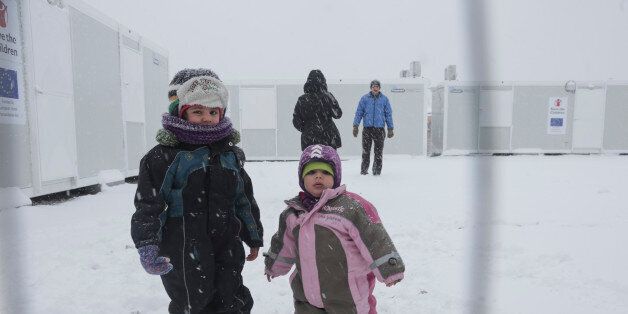 Children in northern Greece in camps in or around Thessaloniki city on 11 January 2017. In Softex camp the temperature was -8Â°C with real feeling sense below -13Â°C and there was about 20cm of snowfall during a half day heaby snowstorm. The tents were snow covered. There is no running water as the pipes froze and many tents don't have electricity and heating. Also many refugees without document have been forced to leave the camp. (Photo by Nicolas Economou/NurPhoto via Getty Images)