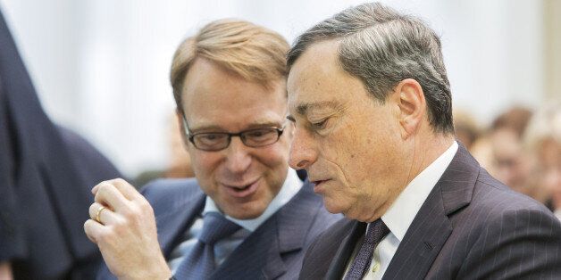 Mario Draghi, president of the European Central Bank (ECB), right, speaks with Jens Weidmann, president of the Deutsche Bundesbank, during the SUERF money and finance forum in Frankfurt, Germany, on Thursday, Feb. 4, 2016. Draghi said the fact that inflation is weak globally won't stop the ECB from adding stimulus for the euro area if needed. Photographer: Martin Leissl/Bloomberg via Getty Images