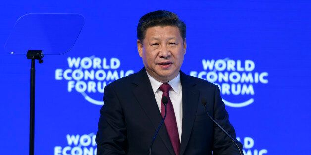 China's President Xi Jinping delivers a speech during the first day of the World Economic Forum, on January 17, 2017 in Davos.Chinese President Xi Jinping said on January 17, 2017 that there is 'no point' in blaming economic globalisation for the world's problems. The leader of the world's second largest economy made the comment at the World Economic Forum, where he is making his first appearance as China seeks to play a greater role in world trade regimes amid rising protectionism in the US and Europe. The global elite begin a week of earnest debate and Alpine partying in the Swiss ski resort of Davos, in a week bookended by two presidential speeches of historic import. / AFP / FABRICE COFFRINI (Photo credit should read FABRICE COFFRINI/AFP/Getty Images)