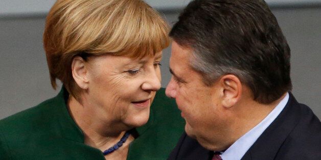 German Chancellor Angela Merkel and Economy Minister Sigmar Gabriel attend a meeting at the lower house of parliament Bundestag on 2017 budget in Berlin, Germany, November 23, 2016. REUTERS/Fabrizio Bensch