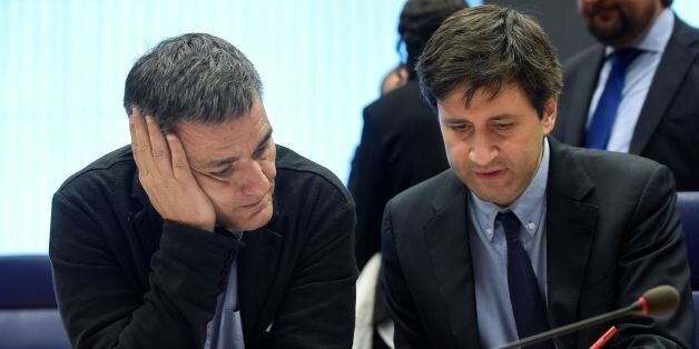 Greek Finance Minister Euclid Tsakalotos (L) listens to a Greek advisor during an Eurogroup meeting in Luxembourg on October 10, 2016.Greece has delivered the reforms necessary to unlock 2.8 billion euros in rescue loans from its massive third bailout, the European Commission's top economics affairs official said on October 10, 2016. / AFP / JOHN THYS (Photo credit should read JOHN THYS/AFP/Getty Images)