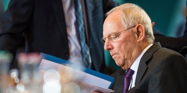 German Finance Minister Wolfgang Schaeuble waits for the beginning of the weekly cabinet meeting at the Chancellery in Berlin on December 14, 2016. / AFP / Odd ANDERSEN (Photo credit should read ODD ANDERSEN/AFP/Getty Images)