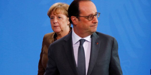 French President Francois Hollande and German Chancellor Angela Merkel make a statement to the media at the Chancellery in Berlin, Germany, December 13, 2016. REUTERS/Fabrizio Bensch