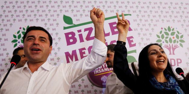 File Photo: Co-chairs of the pro-Kurdish Peoples' Democratic Party (HDP), Selahattin Demirtas and Figen Yuksekdag celebrate election results during a news conference in Istanbul, Turkey, June 7, 2015. REUTERS/Murad Sezer/File Photo