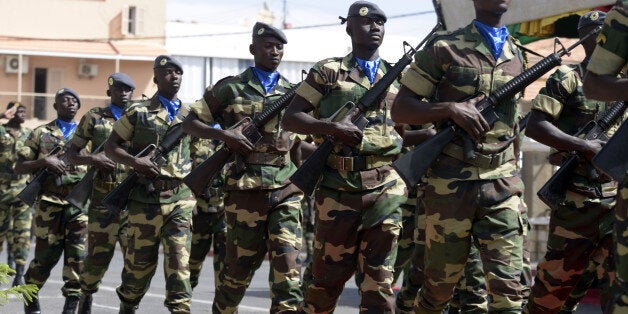 Soldiers parade during the closing ceremony of the three-week joint military exercise between African, US and European troops, known as Flintlock, on February 29, 2016 in Saint Louis.Some 1,700 members of the special forces from nearly thirty countries from Africa, America and Europe, including France and Britain, are taking part in military exercises from February 8-29 according to AFRICOM, the military command of the USA for Africa. / AFP / SEYLLOU (Photo credit should read SEYLLOU/AFP/Getty Images)