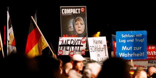 Supporters of the right-wing Alternative for Germany (AfD) demonstrate against the German government's new policy for migrants, in Erfurt, Germany October 21, 2015. REUTERS/Axel Schmidt