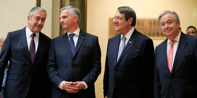 Turkish Cypriot leader Mustafa Akinci (L) speaks with Swiss Foreign minister Didier Burkhalter next to Cypriot President Nicos Anastasiades and United Nations Secretary General Antonio Guterres before the Conference on Cyprus at the European headquarters of the United Nations in Geneva, Switzerland, January 12, 2017. REUTERS/Pierre Albouy