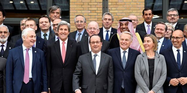 (FromL) Russian Ambassador to France Alexander Orlov, US Secretary of State John Kerry, French President Francois Hollande, French Foreign Minister Jean-Marc Ayrault, European Union Foreign Policy Chief Federica Mogherini and French State Secretary for European Affairs Harlem Desir pose for a group photo during the Mideast peace conference in Paris on January 15, 2017.Foreign ministers and representatives from around 70 countries are seeking to revive the moribund Israeli-Palestinian peace proce