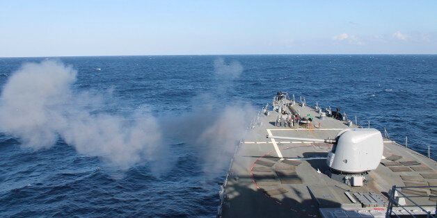 Atlantic Ocean, November 11, 2013 - The guided-missile destroyer USS Mahan (DDG 72) fires a 5-inch gun during a training exercise.