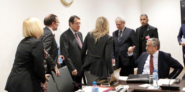 GENEVA, SWITZERLAND - JANUARY 11 : Turkish Cypriot leader Mustafa Akinci (R) and Greek Cypriot leader Nicos Anastasiades (3rd L) attend the third day of Cyprus talks at United Nations Office in Geneva, Switzerland on January 11, 2017. Turkish Cypriot leader Mustafa Akinci and Greek Cypriot leader Nicos Anastasiades met for several days of closed-door meetings in Switzerland under the auspices of the UNs Cyprus envoy, Espen Barth Eide. (Photo by Christos Avraamides / Handout/Anadolu Agency/Getty Images)