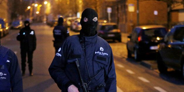 A Belgian police officer stands guard at the scene of a security operation in the Brussels district of Molenbeek, Belgium March 18, 2016. Picture taken March 18, 2016. REUTERS/Francois Lenoir