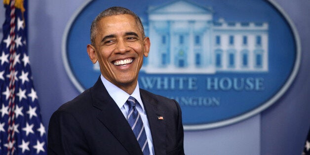 U.S. President Barack Obama smiles as he speaks to journalists during his last news conference of the year at the White House in Washington, U.S., December 16, 2016. REUTERS/Carlos Barria