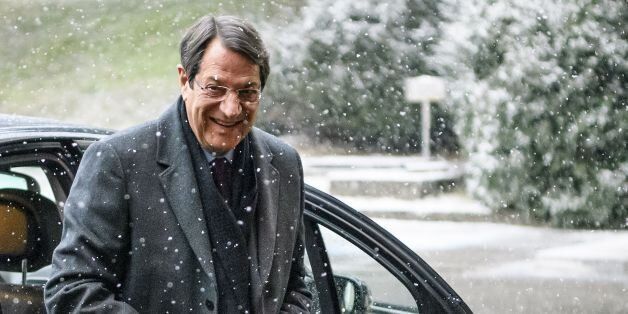 Cypriot President Nicos Anastasiades arrives under snowfall on the second day of UN-sponsored Cyprus peace talks on January 10, 2017 in Geneva.Rival Cypriot leaders resume UN-brokered peace talks in Geneva billed as a historic opportunity to end decades of conflict on the divided island, but the outcome is far from certain. / AFP / FABRICE COFFRINI (Photo credit should read FABRICE COFFRINI/AFP/Getty Images)