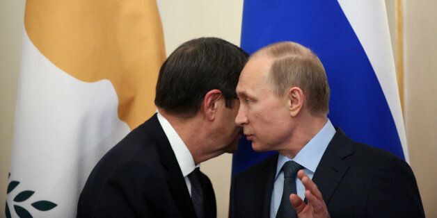 MOSCOW, RUSSIA - FEBRUARY 25: Russian President Vladimir Putin (R) and Cyprus President Nicos Anastasiades (L) during a joint press conference in Novo Ogaryvo State Residence on February 25, 2015 in Moscow, Russia. During his one-day visit to the country, the Cypriot president signed a military agreement which would allow Russian ships to make port calls in Cyprus. (Photo by Sasha Mordovets/Getty Images)
