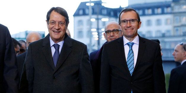 Cypriot President Nicos Anastasiades (L) arrives with U.N. special envoy Espen Barth Eide for the Cyprus reunification talks at the United Nations in Geneva, Switzerland January 9, 2017. REUTERS/Denis Balibouse