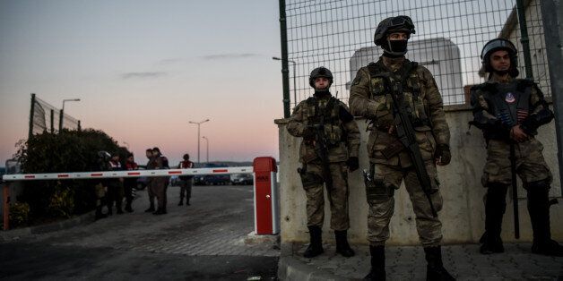 Turkish special force soldiers stand guard at the courthouse on December 27, 2016 at silivri district in Istanbul. Almost 30 Turkish police will go on trial in Istanbul on December 27, 2016 charged with involvement in the July 15 coup bid, the city's first trial of alleged putschists. With indictments prepared against over 1,200 people, and some 41,000 under arrest in total, the trials following the failed coup against President Recep Tayyip Erdogan are set to be the most far-reaching legal process in Turkish history. / AFP / OZAN KOSE (Photo credit should read OZAN KOSE/AFP/Getty Images)