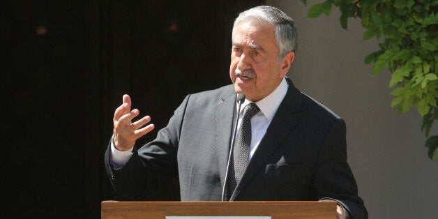 Turkish Cypriot leader Mustafa Akinci speaks to the media during a visit by Turkish Prime Minister Binali Yildirim in the Turkish-administered northern part of Cyprus, June 1, 2016. REUTERS/Yiannis Kourtoglou