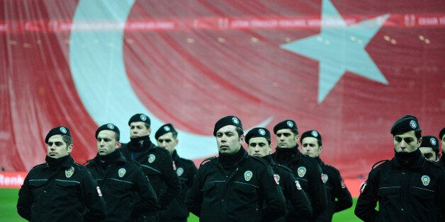 Turkish riot police stand guard before a soccer exhibition game at Besiktas Vodafone Arena in Istanbul, Turkey, December 22, 2016. REUTERS/Yagiz Karahan