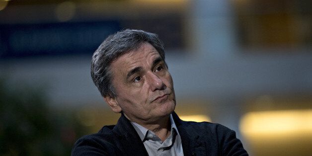 Euclid Tsakalotos, Greece's finance minister, listens to a question during a Bloomberg Television interview at the International Monetary Fund (IMF) and World Bank Group Annual Meetings in Washington, D.C., U.S., on Friday, Oct. 7, 2016. The IMF warned this week that rising political tensions over globalization are threatening to derail a world recovery already seeking a reliable growth engine. Photographer: Andrew Harrer/Bloomberg via Getty Images