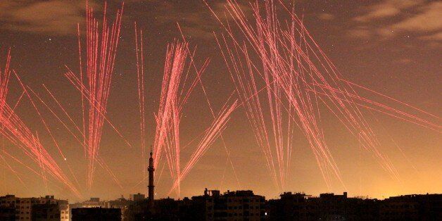 DAMASCUS, SYRIA - JANUARY 01: Lights illuminate the sky after regime forces' gunfires into the air during New Years celebrations in Damascus, Syria on January 01, 2017. (Photo by Mohammed Eyad/Anadolu Agency/Getty Images)
