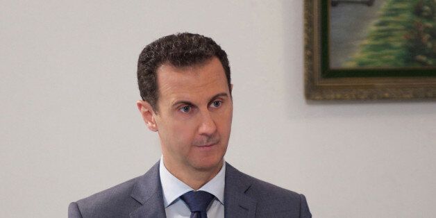 Syria's President Bashar al-Assad speaks during an interview with al-Watan newspaper in Damascus, Syria, in this handout picture provided by SANA on December 8, 2016. SANA/Handout via REUTERS ATTENTION EDITORS - THIS IMAGE WAS PROVIDED BY A THIRD PARTY. EDITORIAL USE ONLY. REUTERS IS UNABLE TO INDEPENDENTLY VERIFY THIS IMAGE.