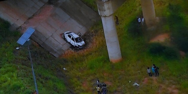 Picture of a TV set taken while TV Globo News shows the car of Greek ambassador in Brazil, Kyriakos Amiridis in Nova Iguacu, Baixada Fluminense, Rio de Janeiro on December 30, 2016. The car was found burned by police, under a bridge with an unidentified corpse inside. / AFP / VANDERLEI ALMEIDA / Brazil OUT / BRAZIL OUT (Photo credit should read VANDERLEI ALMEIDA/AFP/Getty Images)