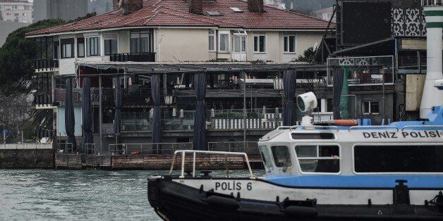 A Turkish Coast police boat (C) is anchored off the coast of the Bosphorus front of the Reina night club, one of the Istanbul's most exclusive party spots, early on January 1, 2017 after at least one gunmen went on a shooting rampage during New Year's Eve celebrations. Thirty-nine people, including many foreigners, were killed when a gunman reportedly dressed as Santa Claus stormed an Istanbul nightclub as revellers were celebrating the New Year, the latest carnage to rock Turkey after a bloody 2016. / AFP / OZAN KOSE (Photo credit should read OZAN KOSE/AFP/Getty Images)