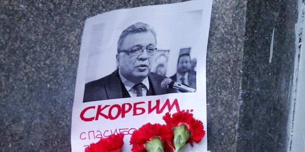MOSCOW, RUSSIA - DECEMBER 20, 2016: Flowers at the entrance to the Russian Foreign Affairs Ministry building to pay tribute to the murdered Russian Ambassador to Turkey Andrei Karlov. The ambassador was shot dead at the opening of an exhibition titled Russia through Turks' Eyes at an art gallery in Ankara on December 19, 2016. Valery Sharifulin/TASS (Photo by Valery Sharifulin\TASS via Getty Images)