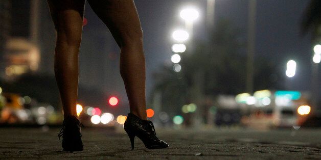 Prostitute at Atlantica avenue in copacabana beach at night, Rio de Janeiro