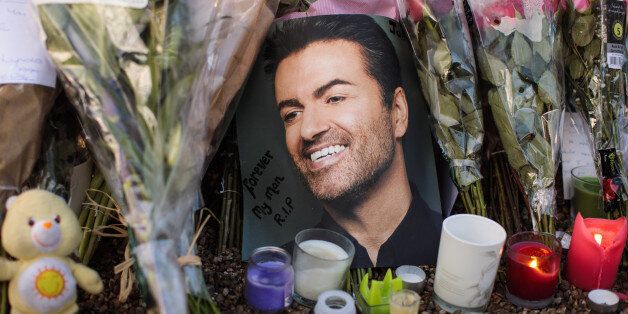 LONDON, ENGLAND - DECEMBER 28: Tributes of flowers, photographs and candles are left outside the home of pop music icon George Michael in The Grove, Highgate on December 28, 2016 in London, England. Singer George Michael died on Christmas day in his country home in Oxfordshire at the age of 53 on December 25. (Photo by Jack Taylor/Getty Images)