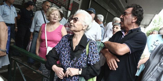 An old woman at a protest rally, held outside the Labour Ministry, in Athens, against new pension cuts, on Tuesday, September 6, 2016 Greece is facing another bailout standoff with its creditors amid reports that eurozone countries will refuse to release additional funds to it this month. (Photo by Panayiotis Tzamaros/NurPhoto via Getty Images)