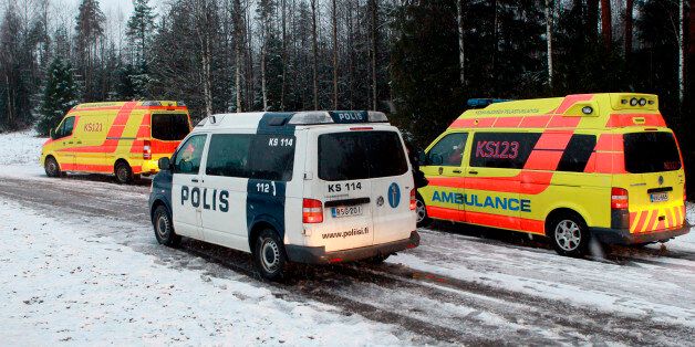 A police vehicle and ambulances are seen in Jyvaskyla December 30, 2011. Two people were shot in a village about 17 km (11 miles) west of Jyvaskyla, north of Helsinki. The police arrested the gunman after a large-scale manhunt where they sealed the area during the search for the gunman. Picture taken December 30, 2011. REUTERS/Juha Sorri/Lehtikuva (FINLAND - Tags: CRIME LAW) NO THIRD PARTY SALES. NOT FOR USE BY REUTERS THIRD PARTY DISTRIBUTORS. FINLAND OUT. NO COMMERCIAL OR EDITORIAL SALES IN FINLAND. THIS IMAGE HAS BEEN SUPPLIED BY A THIRD PARTY. IT IS DISTRIBUTED, EXACTLY AS RECEIVED BY REUTERS, AS A SERVICE TO CLIENTS