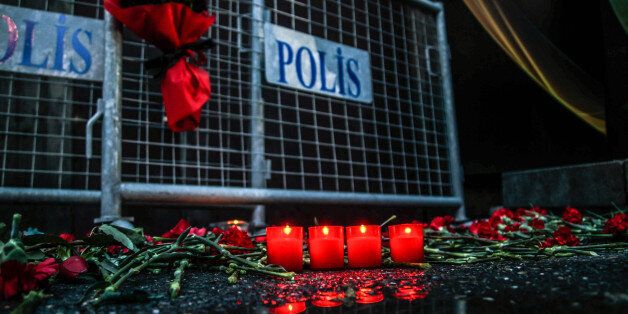 ISTANBUL, TURKEY - JANUARY 1: Flowers and candles are placed out side the Reina nightclub by the Bosphorus, following a gun attack on New Year's Eve, on January 1, 2017 in Istanbul, Turkey. According to Turkey's interior minister Suleyman Soylu at least 39 people, including 15 foreigners, were killed and 40 wounded at Istanbul's famous Reina nightclub during a New Year Party. (Photo by Daghan Kozanoglu/Getty Images)