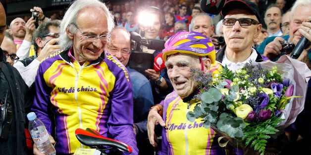 SAINT-QUENTIN-EN-YVELINES, FRANCE - JANUARY 04: French centenarian cyclist Robert Marchand, aged 105 reacts after cycling in a bid to beat his record for distance cycled in one hour in the over-105 age group at the indoor velodrome National of Saint-Quentin En Yvelines on January 04, 2017 in Montigny Le Bretonneux, France. At 105, Robert Marchand established an hour world record by bike, traveling 22,547 kilometers (14.08 miles), in the over-105 age group. (Photo by Chesnot/Getty Images)
