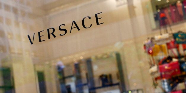 A sign is seen for high-end retail store Versace along 5th Avenue in New York May 19, 2013. Luxury spending in the United States collapsed after the 2008 financial crisis but roared back to pre-crisis levels by 2012. Sales in the Americas is expected to rise 5-7 percent this year, compared to 6-8 percent in mainland China and 0-2 percent in Europe, according to consultancy Bain & Co. Picture taken May 19, 2013. To match Insight LUXURY-US/ REUTERS/Eric Thayer (UNITED STATES - Tags: BUSINESS LOGO SOCIETY WEALTH)