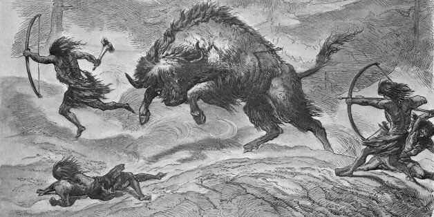 (Original Caption) Prehistoric European Lake Dwellers hunting the aurochs, a wild ancestor of domestic cattle. Engraving.
