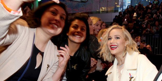 LOS ANGELES, CA - NOVEMBER 16: Fans take a Selfie with actress Jennifer Lawrence (R) at the premiere of The Hunger Games: Mockingjay Â Part 2 on November 16, 2015 in Los Angeles, California (Photo by Jonathan Leibson/Getty Images for Samsung)