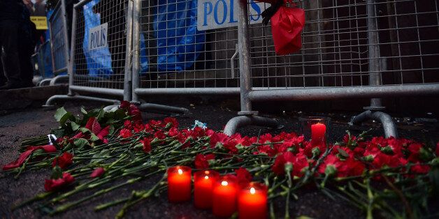 Flowers have been laid in front of the Reina night on January 1, 2017 in Istanbul, after a gunman killed 39 people, including many foreigners, in a rampage at an upmarket nightclub in Istanbul where revellers were celebrating the New Year.The shooting spree at the waterside Reina nightclub was unleashed when 2017 in Turkey was just 75 minutes old, after a year of unprecedented bloodshed that saw hundreds of people die in strikes blamed on jihadists and Kurdish militants and a bloody failed coup. / AFP / YASIN AKGUL (Photo credit should read YASIN AKGUL/AFP/Getty Images)