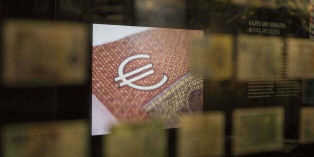 An illuminated signs shows the euro currency symbol on display inside the Deutsche Bundesbank's money museum in Frankfurt, Germany, on Thursday, Dec. 29, 2016. German business sentiment rose to the highest level in almost three years in December, signaling growth in Europe's largest economy picked up speed toward the end of the year. Photographer: Alex Kraus/Bloomberg via Getty Images