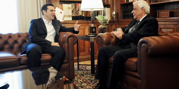 Greek Prime Minister Alexis Tsipras (L) talks to Greek President Prokopis Pavlopoulos during a meeting at the presidential palace in Athens, Greece November 20, 2015. The conclusion of the recapitalisation of Greece's banks will mark an end to a period of uncertainty, the country's Prime Minister Alexis Tsipras said on Friday. REUTERS/Michalis Karagiannis